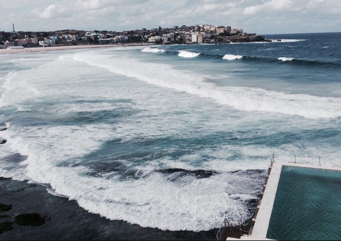 Rolling waves at Bondi Beach beside the ocean swimming pool