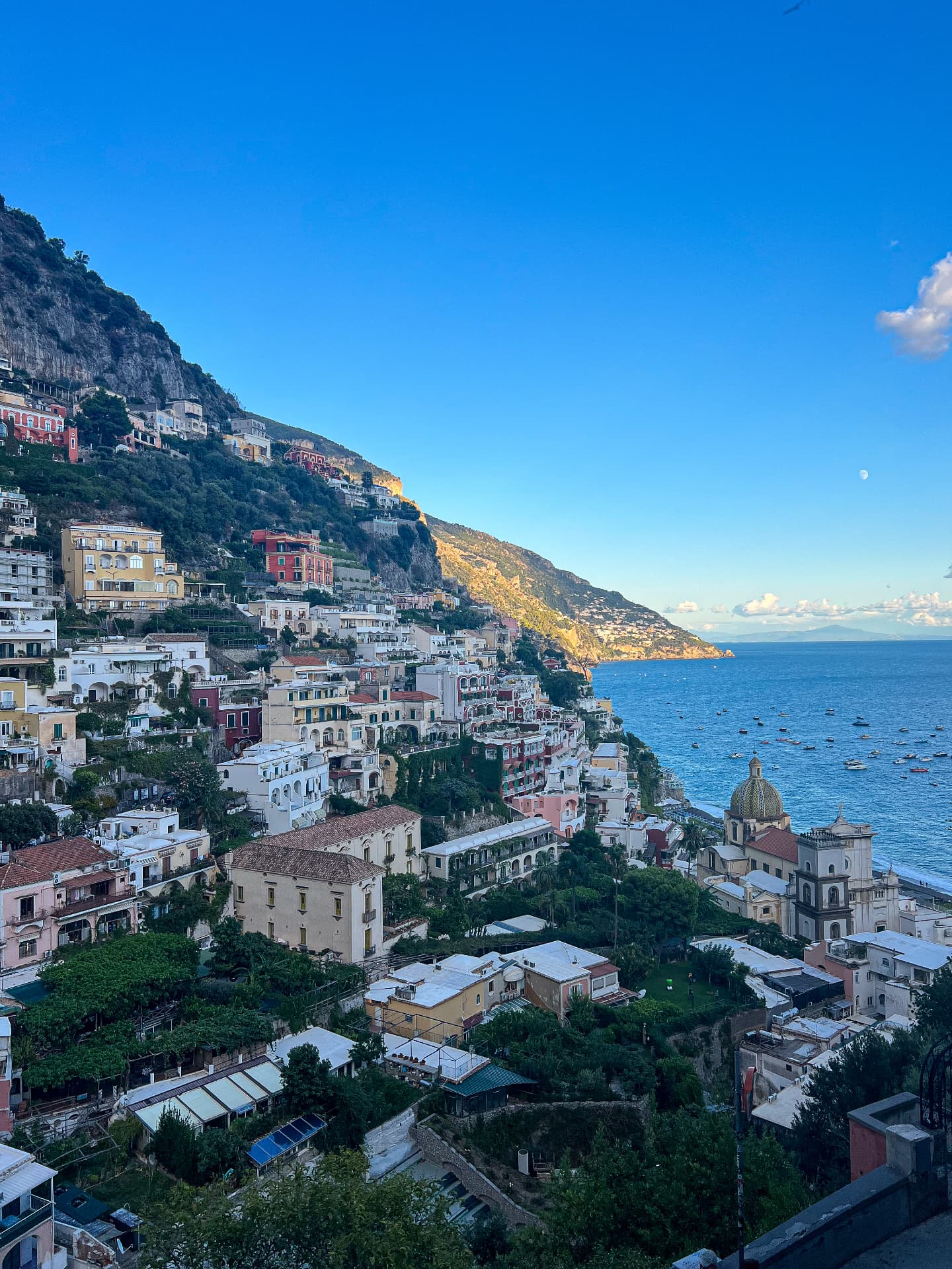 Positano's pastel houses cascading down the hillside towards the Mediterranean