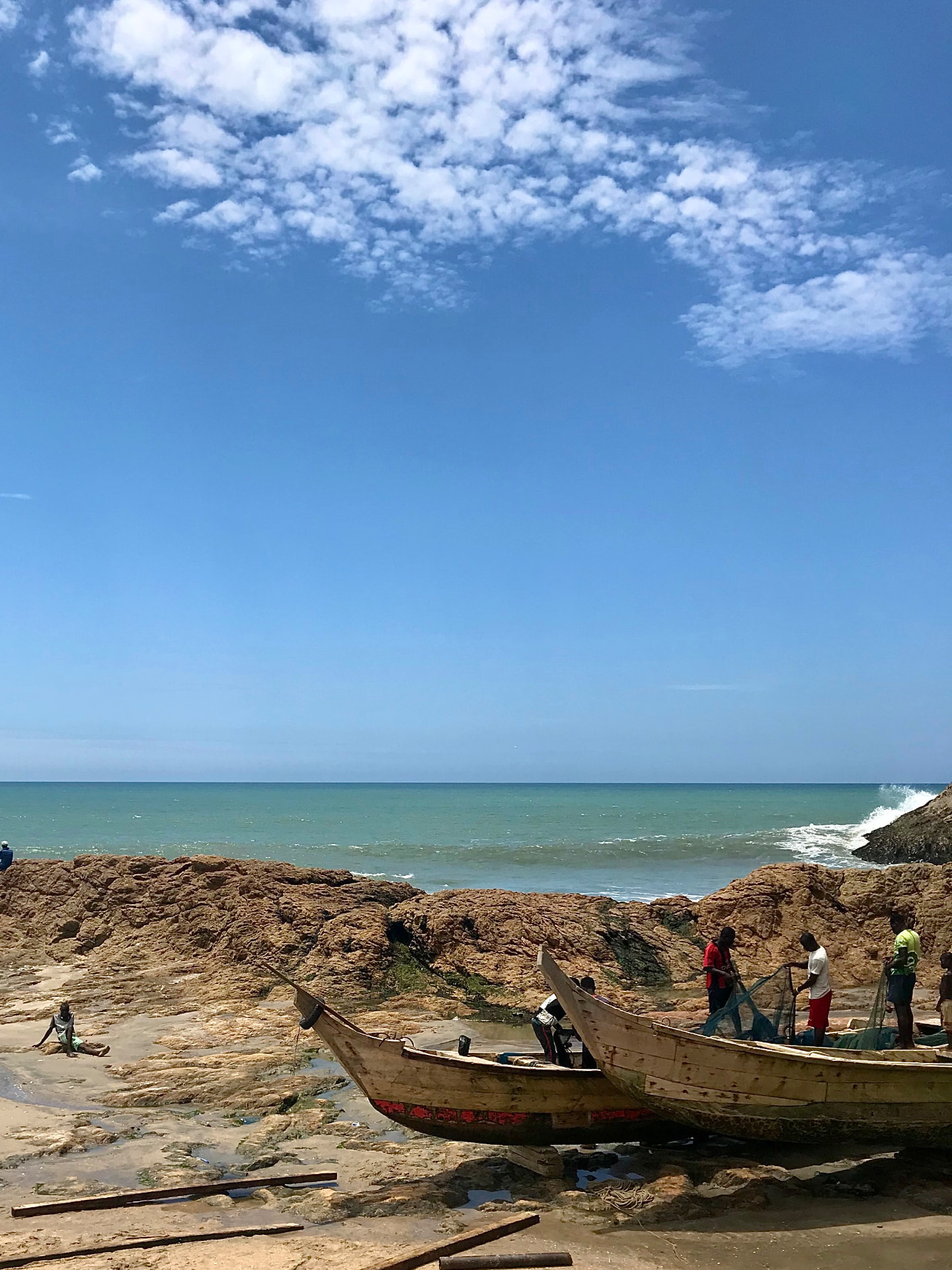 Fishing boats on a rocky coastline